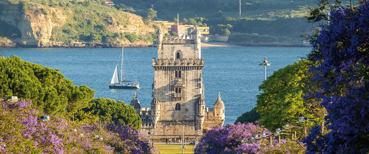 A view down a street towards Bélem Tower, Lisbon